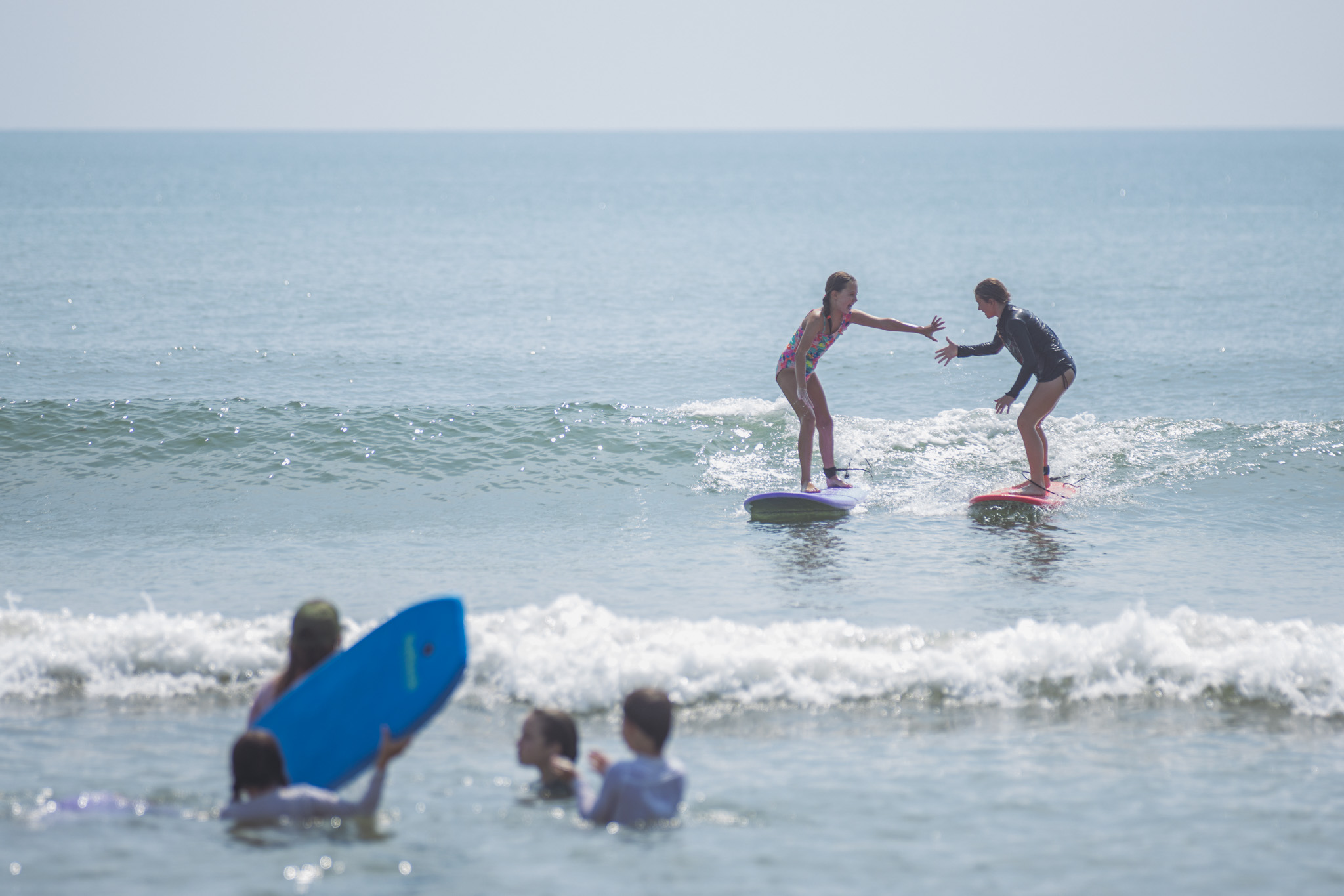 Local youth take part in the Surf Asylum clinic Monday morning on Amelia Island. Photo by Ashley Chandler/News-Leader