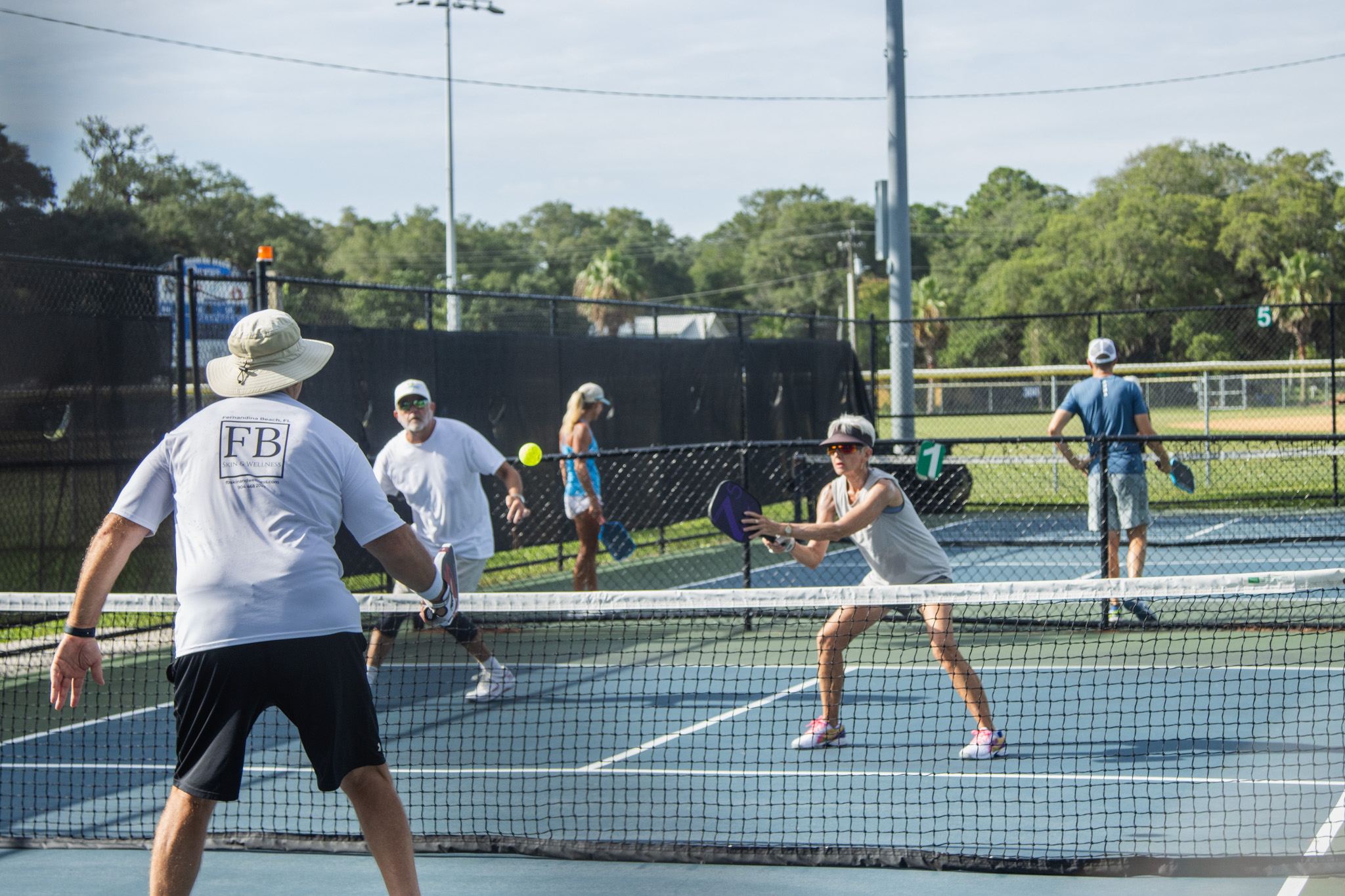 Pickleball players compete at the Fernandina Beach Central Park pickleball courts on Tuesday. Photo by Ashley Chandler/News-Leader