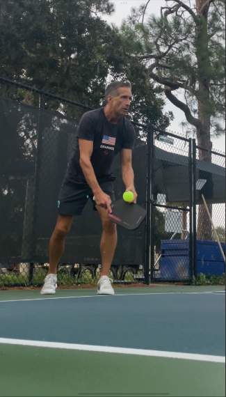Fernandina Beach resident Paul Caruso prepares to serve in a pickleball match. Submitted