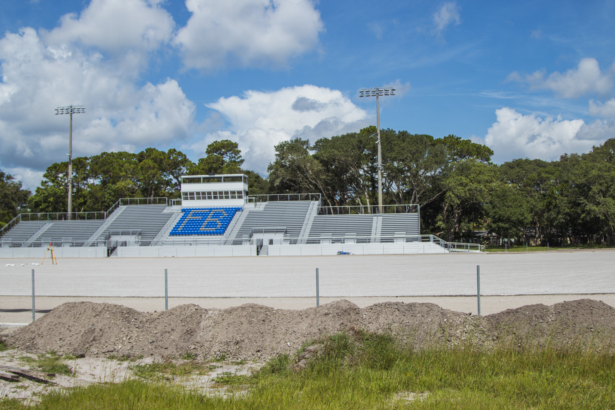 Construction of the Fernandina Beach High School stadium is nearing completion. Work continued Tuesday on the track, field and concession stand. Photo by Ashley Chandler/News-Leader