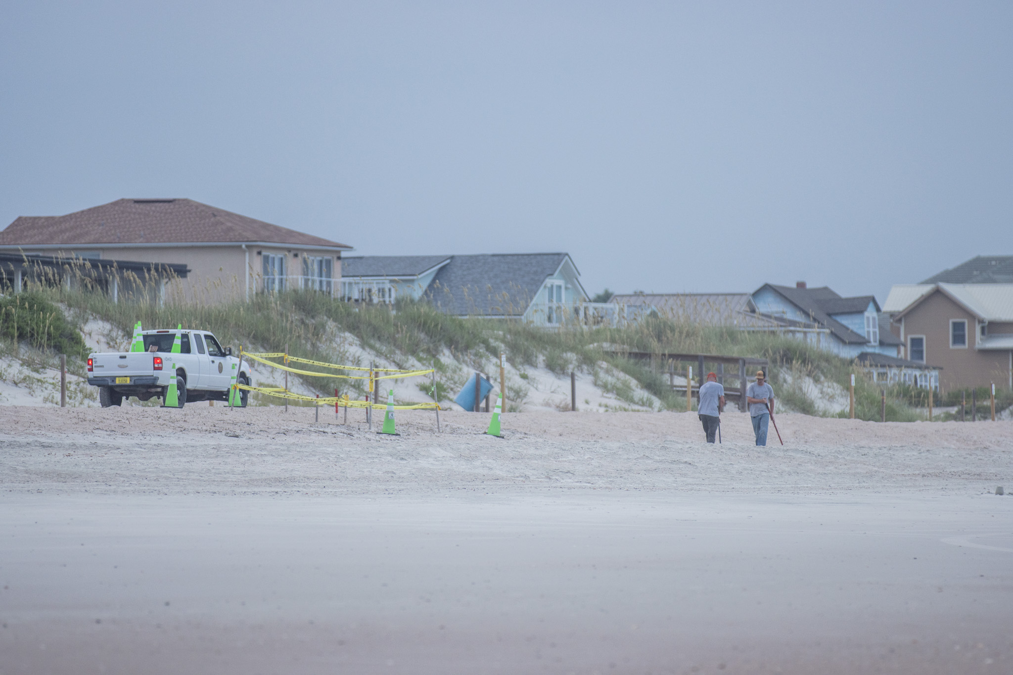 Nassau County staff rakes the sand between a sea turtle nest and the ocean on July 22 on American Beach. The county’s beach raking program was put in place in an effort to avoid the potential negative impacts of tire tracks on new sea turtle hatchlings. 