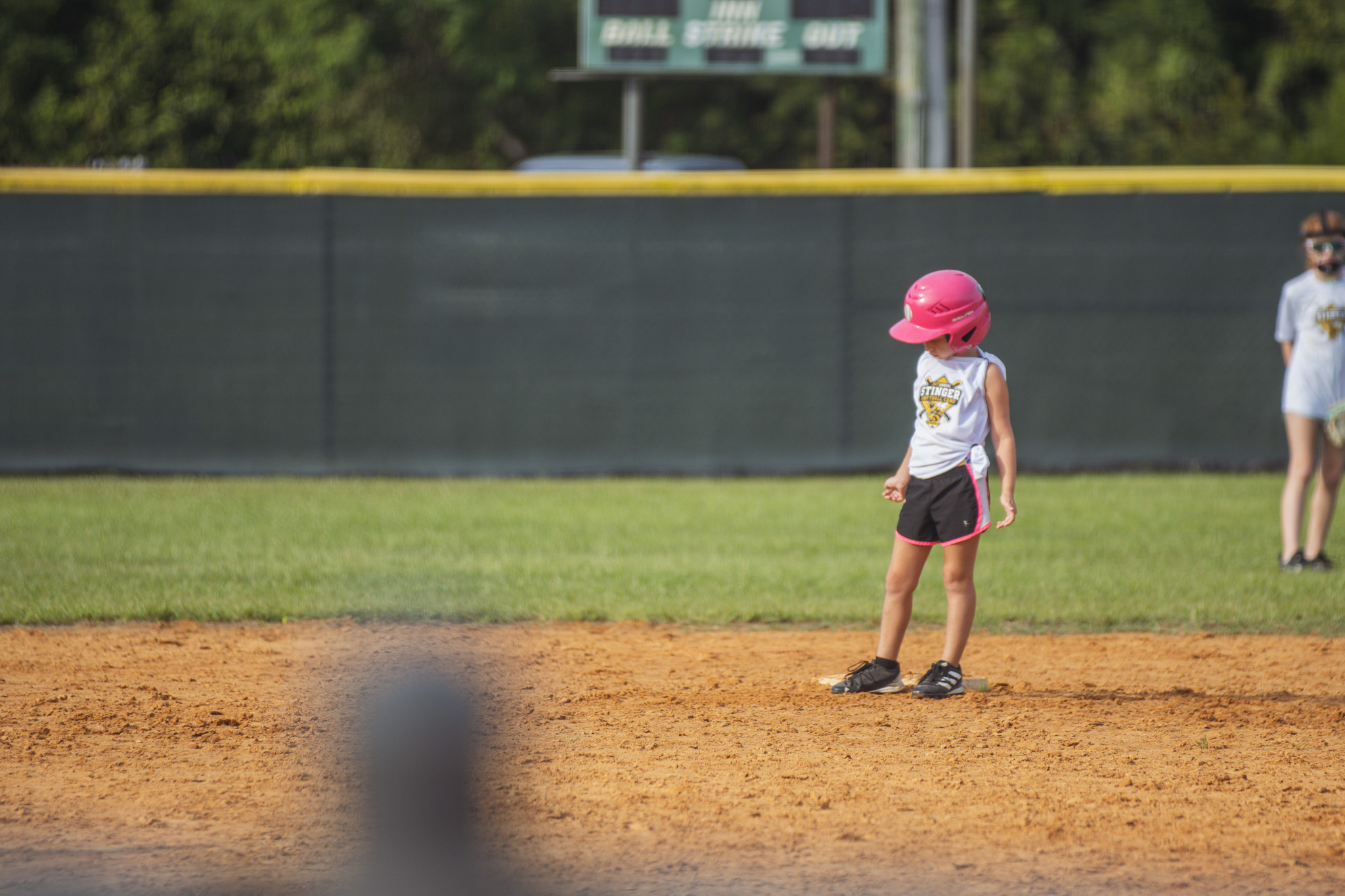 Six-year-old Ada Thompson was one of the youngest participants at the YHS softball camp this summer. Photo by Ashley Chandler/News-Leader