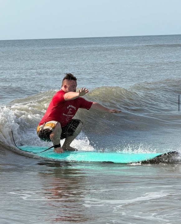 The Nassau County Special Olympics Surf Team surf the waves at in Fernandina Beach. Submitted photo