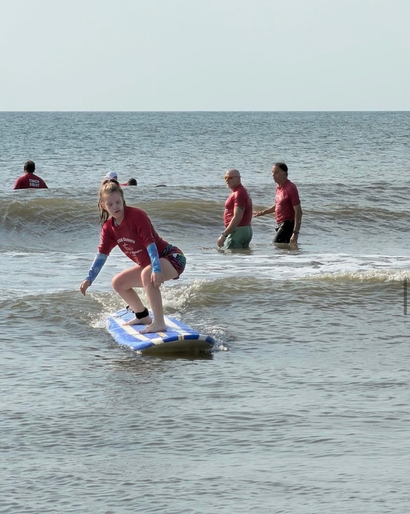 The Nassau County Special Olympics Surf Team surf the waves at in Fernandina Beach. Submitted photo