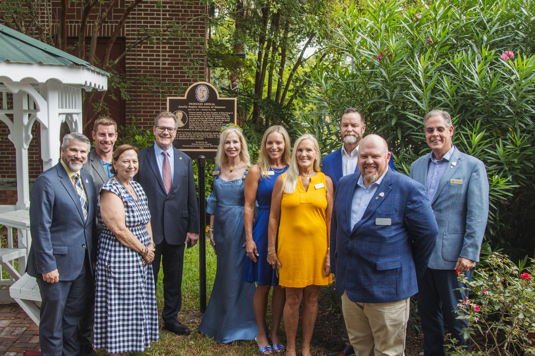  From left, Mitch Keiter, Nassau County Clerk of Circuit Court and Comptroller; Mayor James Antun; City Commissioner Genece Minshew; State Rep. Dean Black; Lynn Leisy, president of the Princess Amelia Chapter of the Florida Society of the Colonial Dames XVII Century; Amy Mizell Green, vice president of the Princess Amelia Chapter; Nassau County School Board member Lissa Braddock ; Congressman Aaron Bean; and Nassau County commissioners Klynt Farmer and A.M. "Hupp" Huppmann. Photo by Ashley Chandler/News-Lea