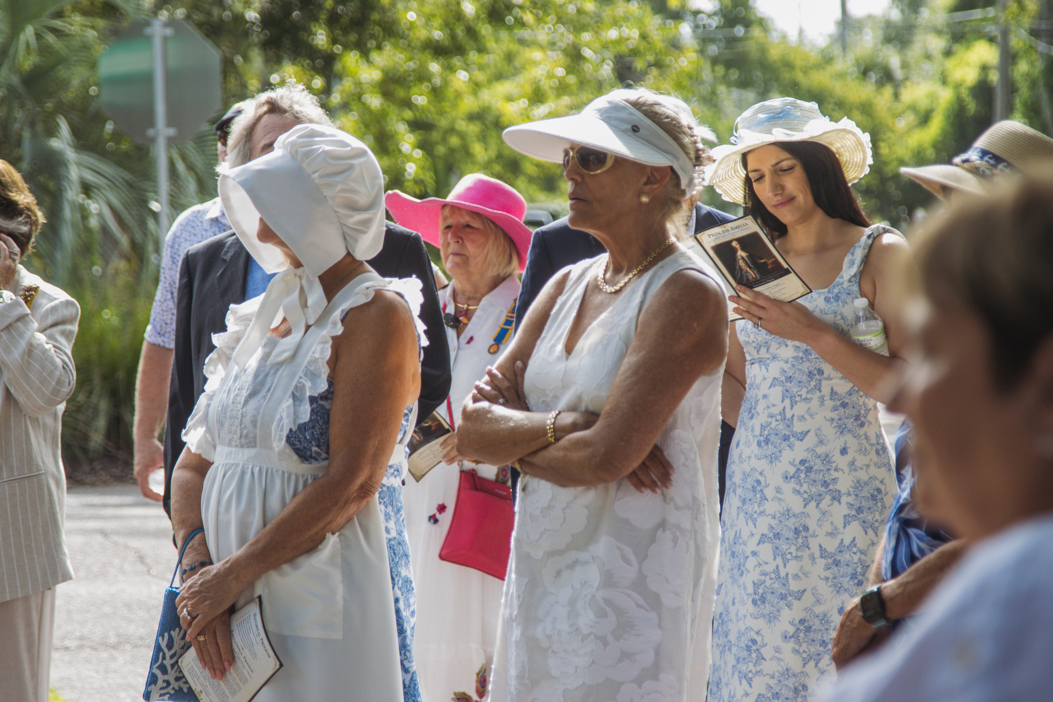 Members of the Florida Society of the Colonial Dames XVII Century, and other attendees of Saturday's event, react to the unveiling of the Princess Amelia historical marker now outside the Amelia Island Museum of History. Photo by Ashley Chandler/News-Leader