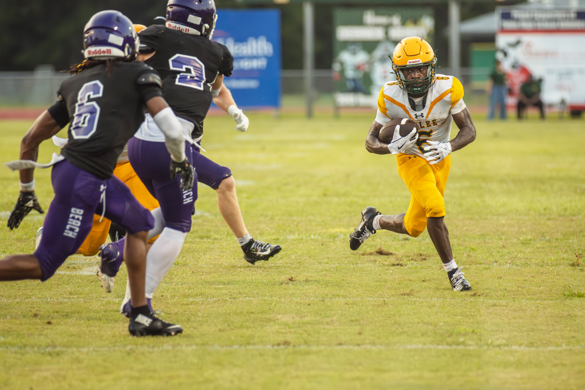 Sophomore Jayden Timmon carries the ball in Yulee High School’s Aug. 14 preseason game. Photo by Ashley Chandler/News-Leader