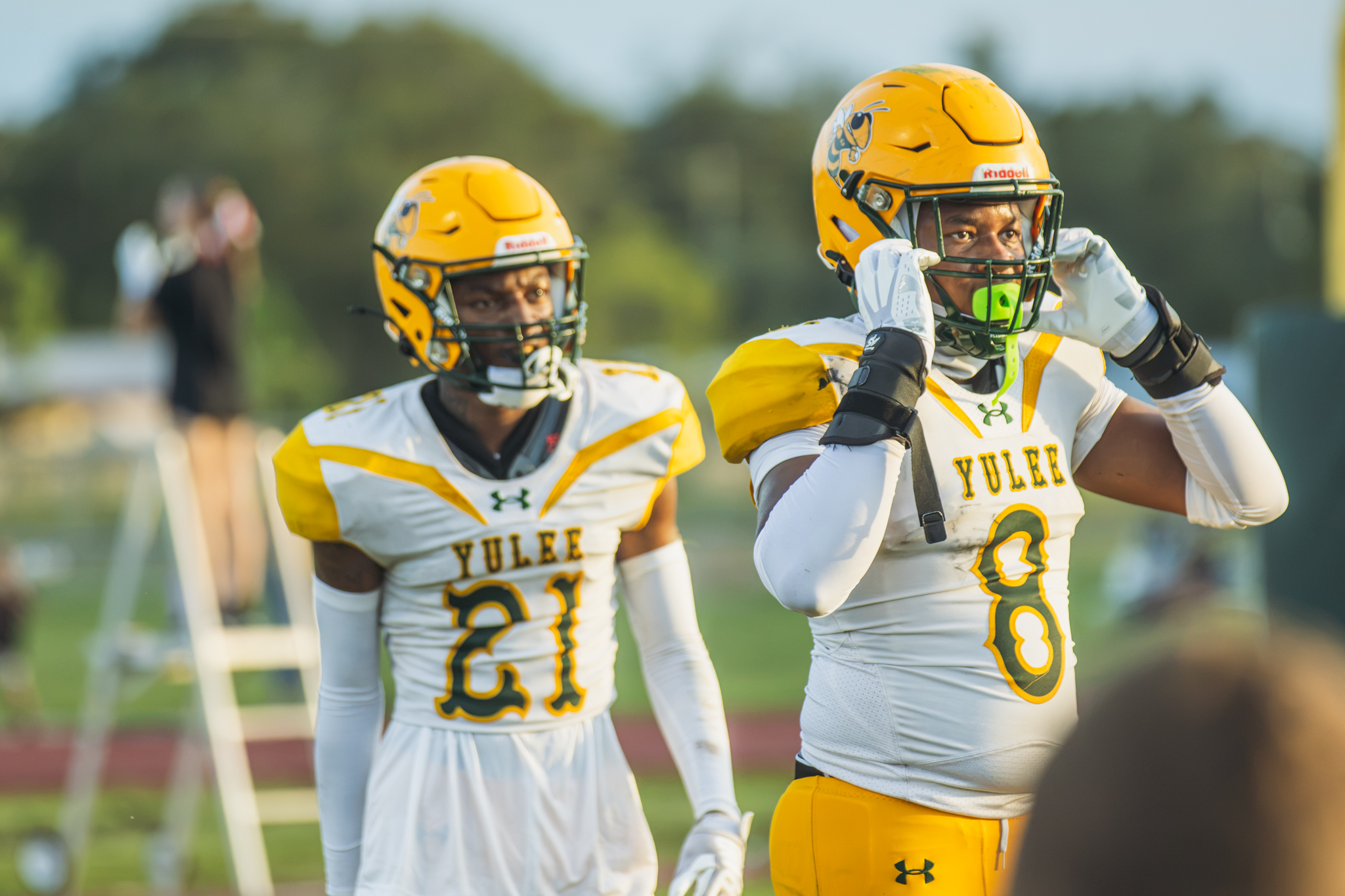 Hornets Jaison Brown, No. 8, and Treviuan Frazier, No. 21, in between plays during an Aug. 14 preseason game. Photo by Ashley Chandler/News-Leader