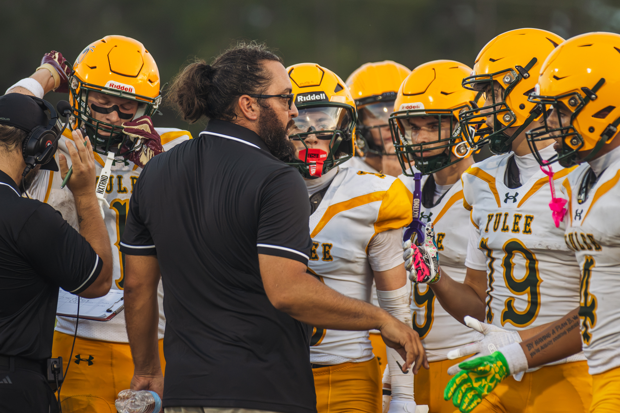 YHS Athletic Director and Head Coach Kyle Dougherty talks to Hornets players during a preseason game Aug. 14. Photo by Ashley Chandler/News-Leader