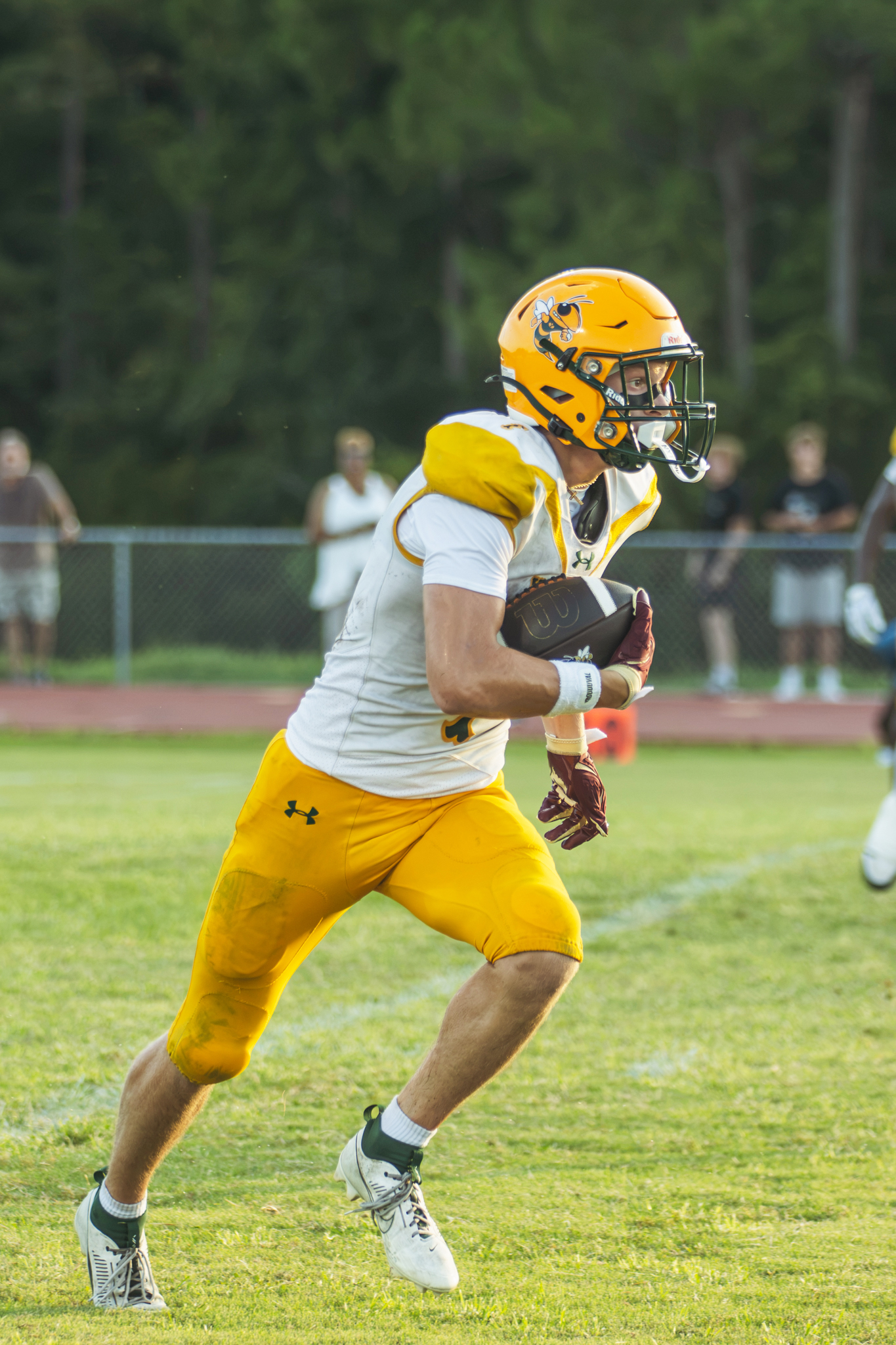 Senior Pete Kuhlman carries the ball in Yulee High School’s Aug. 14 preseason game. Photo by Ashley Chandler/News-Leader