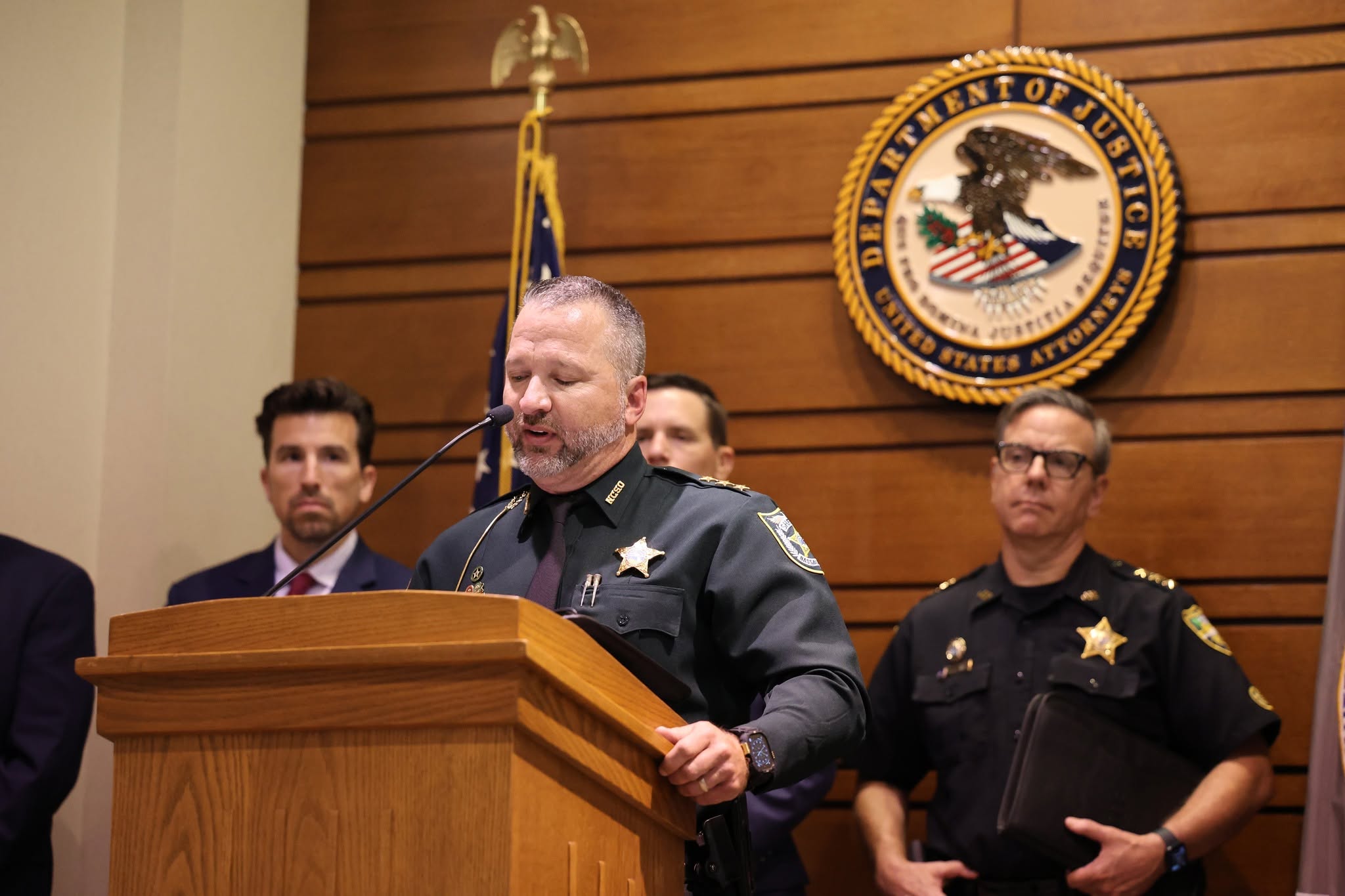 submitted photo NCSO Undersheriff Jon Hooper addresses 13 alleged gang members arrested at a Department of Justice press conference in Jacksonville. Submitted