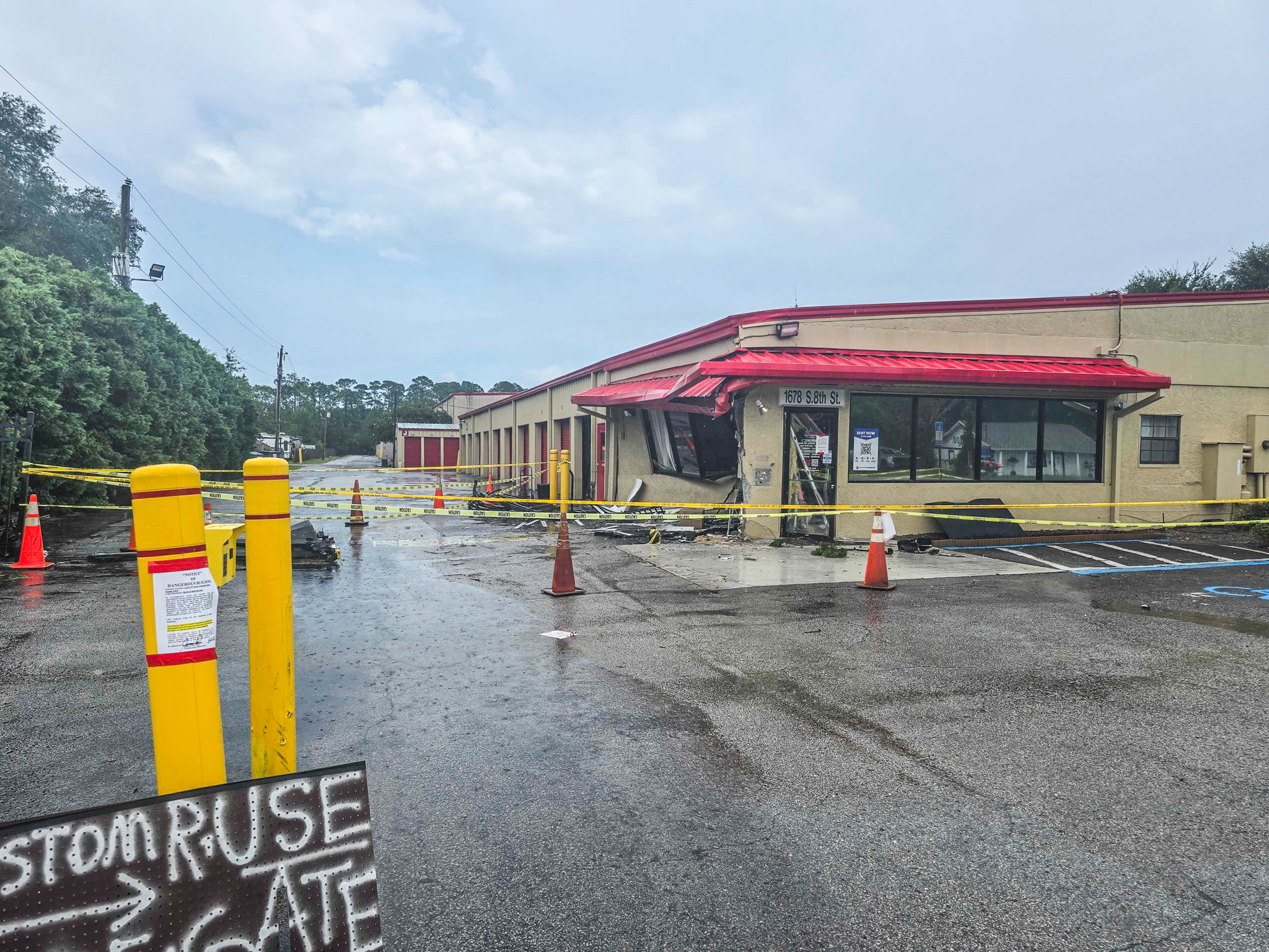 Debris is rained on Thursday afternoon at Devon Self Storage after a vehicle smashed into the building. Photo by Ashley Chandler/News-Leader