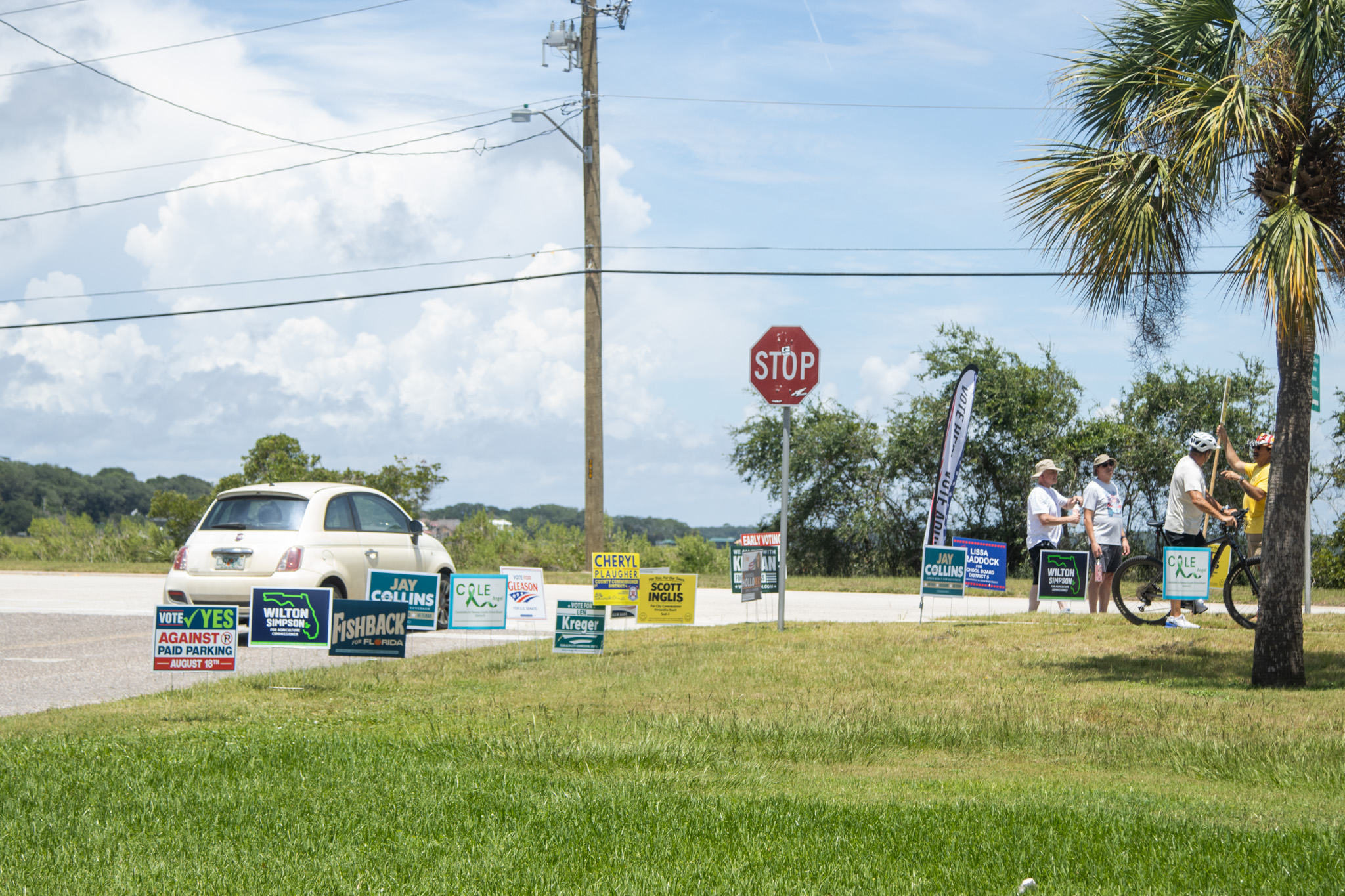 Campaign signs and campaigners are posted at the entrance of the Atlantic Recreation Center on Thursday in Fernandina Beach. Photo by Ashley Chandler/News-Leader