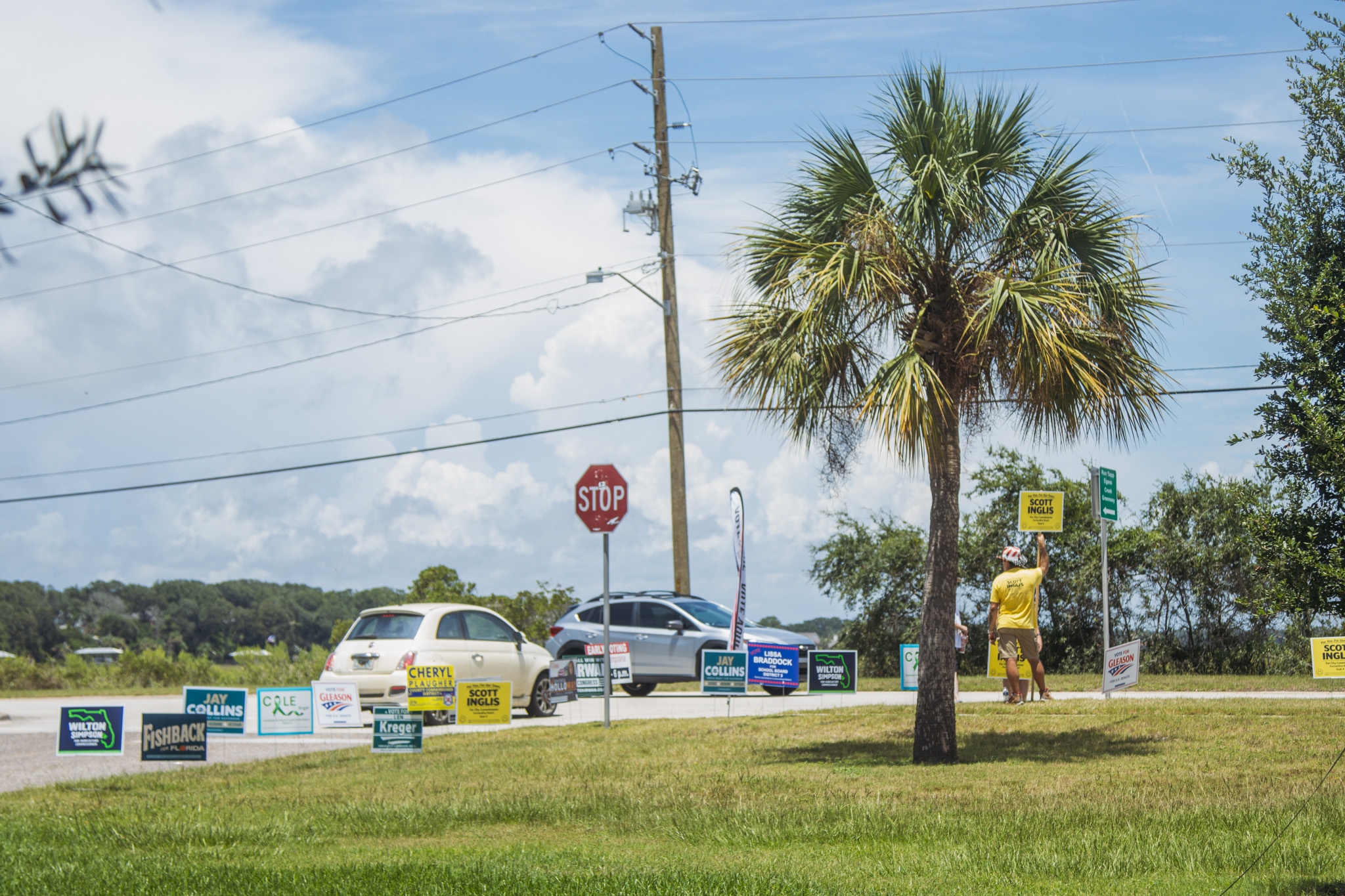 Campaign signs and campaigners are posted at the entrance of the Atlantic Recreation Center on Thursday in Fernandina Beach. Photo by Ashley Chandler/News-Leader