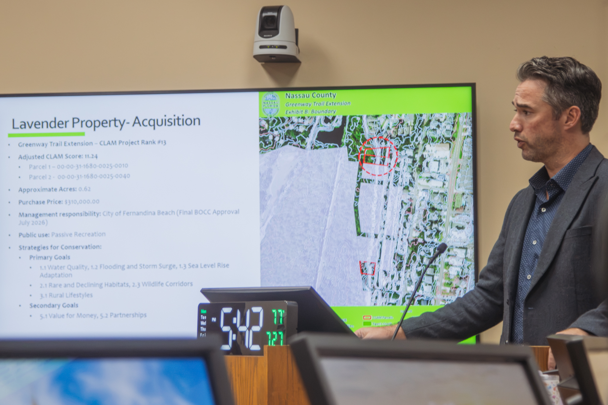 Nassau County Conservation Land Manager Taylor Clem speaks at the July 27 meeting about the Lavender property acquisition that will extend the Greenway Trail in Fernandina Beach. Photo by Ashley Chandler/News-Leader