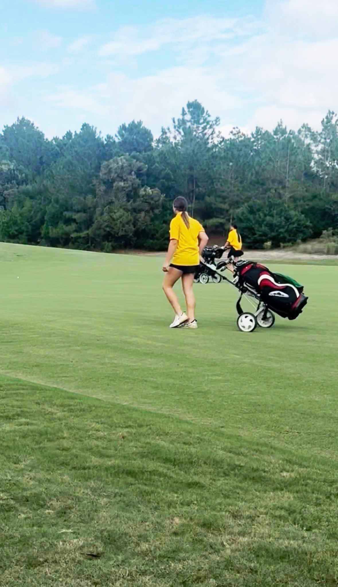Brooklyn Sawyer, front, and Kyli Mathis, out on the course with YHS golf during the 2025 season. Courtesy of YHS girls golf. Courtesy of YHS girls golf