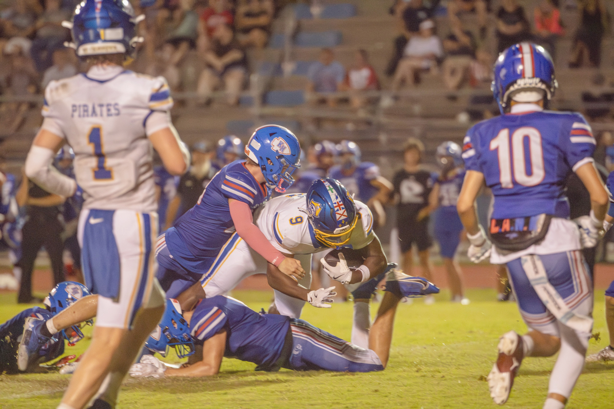 Fernandina Beach High School’s Fred Jones reaches for yards as he’s taken down by a Keystone Heights player in the Pirates’ Aug. 14 game. Photo by Nick Blank/News-Leader