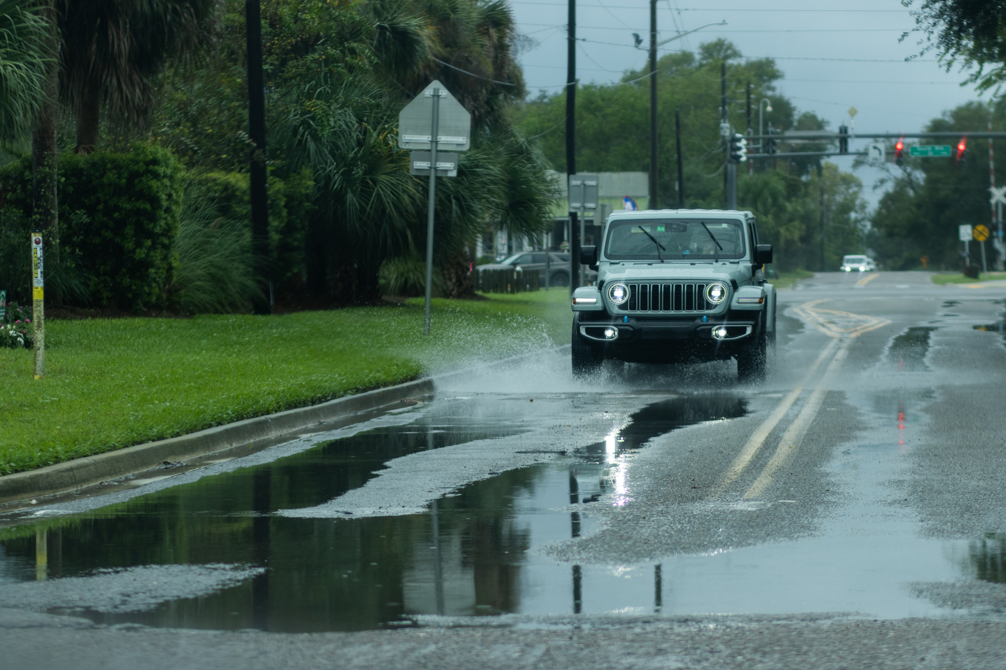 A driver splashes through a puddle on Lime Street in Fernandina Beach. Ashley Chandler/News-Leader