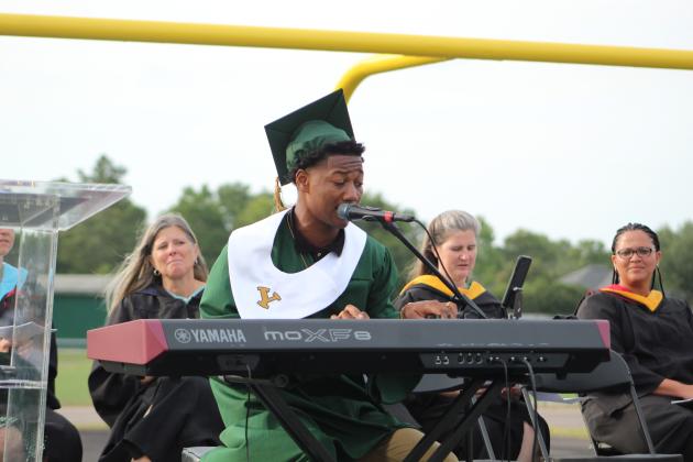 Yulee senior Braxton Gardner plays the keyboard and performs the alma mater Wednesday.