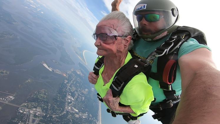 Ruby Coleman falls through the clouds at 125 mph with Skydive Amelia Island tandem instructor Gregory Meyer.