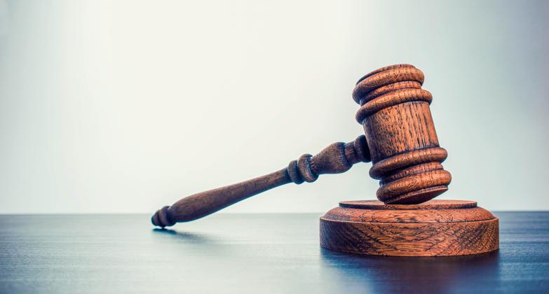 A Jacksonville attorney is suing the Nassau County Clerk of Court's office because it won't accept checks as payment.