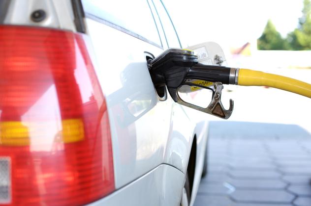 Photo of car refueling gas.