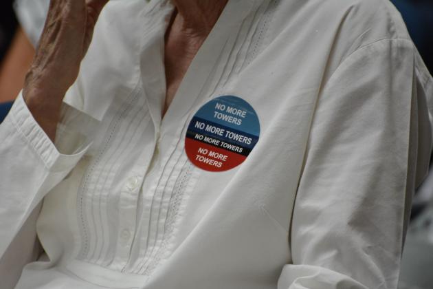 As part of a grassroots operation, stickers and signs were passed out during the May 23 meeting urging commissioners to stand by their ordinance and people. Marissa Mahoney/News-Leader