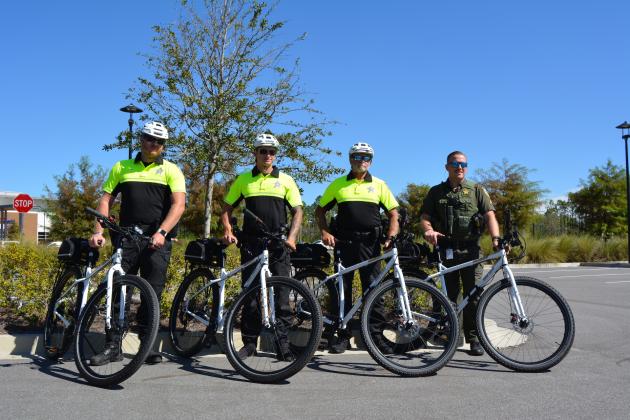 Three NCSO deputies gave a quick demonstration of their newfound bike riding skills during the unveiling. Photos by Marissa Mahoney/News-Leader.