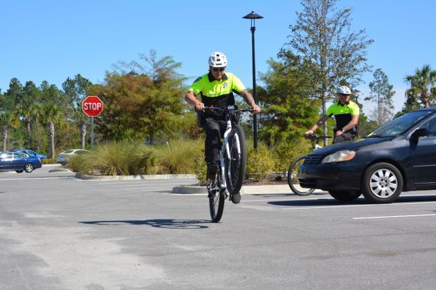 Three NCSO deputies gave a quick demonstration of their newfound bike riding skills during the unveiling. Photos by Marissa Mahoney/News-Leader.