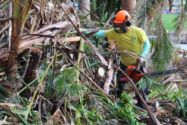 Volunteers from the Church of Jesus Christ of Latter-day Saints pull out the heavy equipment to help local homeowners clear their property of debris in Cape Coral. Cape Coral was only recently cleared for volunteers to enter after the search for survivors ended.