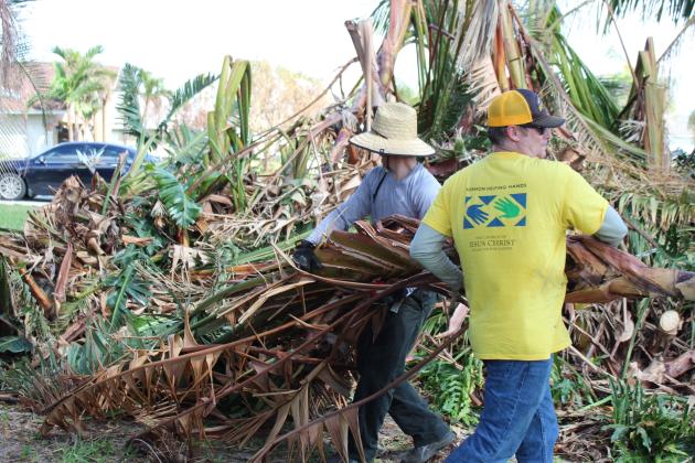 Volunteers from the Church of Jesus Christ of Latter-day Saints pull out the heavy equipment to help local homeowners clear their property of debris in Cape Coral. Cape Coral was only recently cleared for volunteers to enter after the search for survivors ended.
