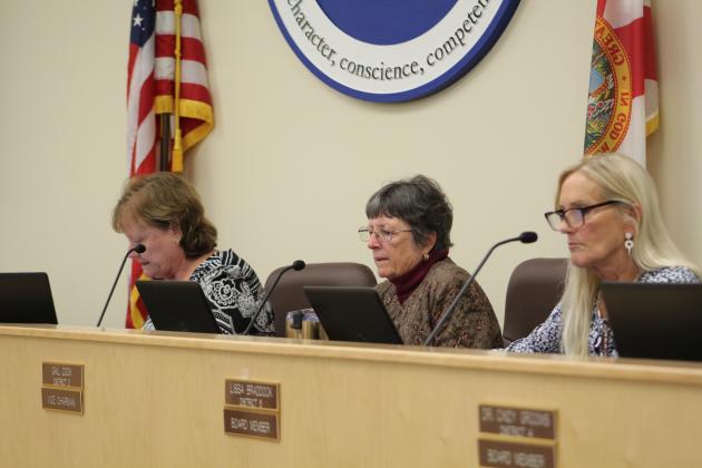 Nassau County School Board chairwoman Donna Martin leads fellow board members Gail Cook and Lissa Braddock through the bid proposals. Photo by Holly Dorman