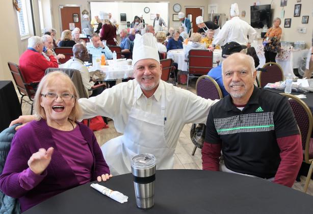 Ed Hubel (center), Hospital President, Baptist Medical Center Nassau, visits with Janice and Robert Rendin during the festivities.