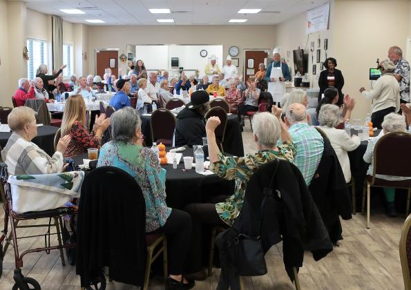 NCCOA’s Annual Thanksgiving event, complete with celebrity servers and happy seniors, filled the Fernandina Beach Senior Life Center’s Grand Hall, Nov. 21. In addition to a tasty meal, eastside and westside seniors danced to music from NCCOA Volunteer Lane Mashburn, owner, Amelia Auto Mart. 