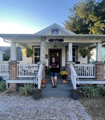 Tina Pezzella proudly stands in front of her new bakery.