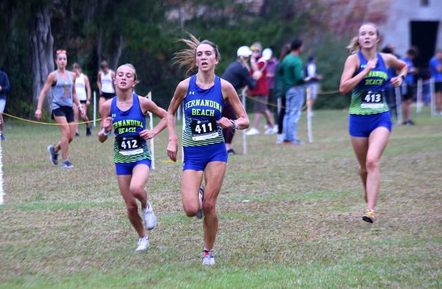 Mikaela Nichols, Nesbitt and Quinn compete in the region meet Friday. Photos by Stephanie Nichols/special.