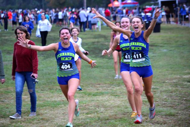 Aislinn Bell, Lauren Quinn and Callie Nesbitt celebrate the Lady Pirates’ eighth-place finish. Photos by Stephanie Nichols/special.