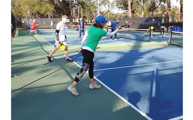 Chris Schultz with Susan Bonnett serving. Submitted photo.