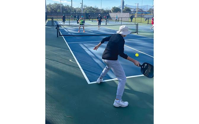 Deb Kienle, foreground, playing against Jill Bolstad and Wendell Lamont. Submitted photo.