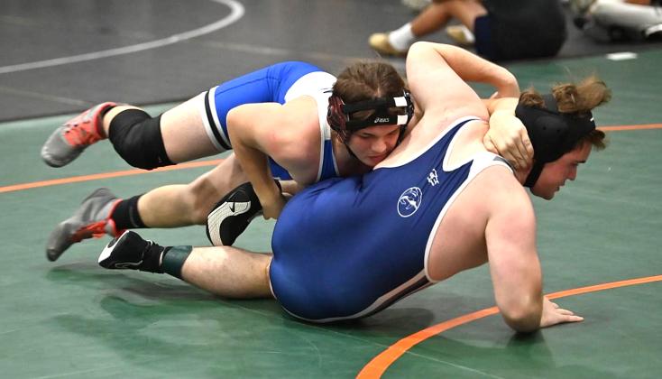 FBHS wrestlers in action over the weekend include, clockwise from top left, Enzo Gamba, Cael Kubatzke, Elijah Smith, Gauge Housely and Nik Saldana.