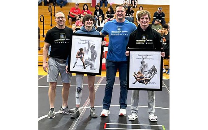 Coach Jeremy Ferry, Caden Kubatzke, coach Eric Kubatzke and Enzo Gamba.