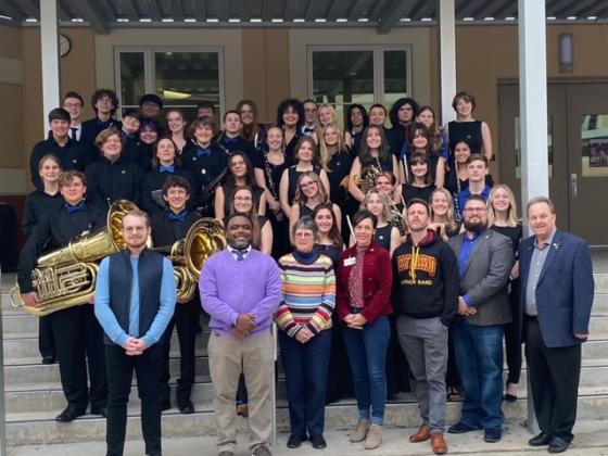 Nassau County band students and directors and Nassau County School Board members gather for a celebratory group photo at the recent All District Band Concert in Jacksonville. Submitted photo.