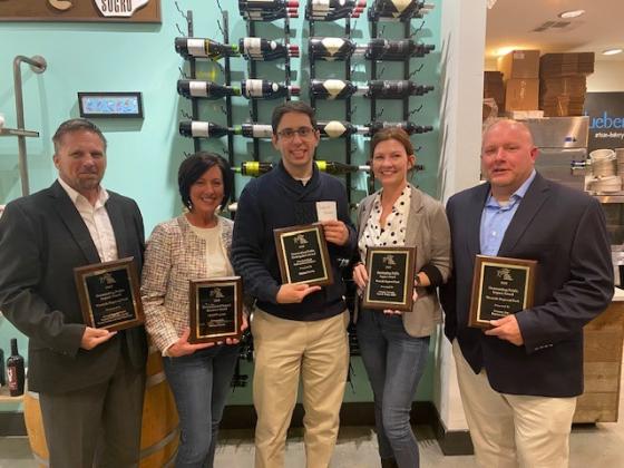 Accepting awards for the Nassau County Board of County Commissioners are, from left, Public Works Director Doug Podiak, Economic Resources Coordinator Holly Coyle, Assistant Planning Director Gabriel Quintas, Director of Strategic Advancement Brandy Carvalho and Parks & Recreation Director Jay Robertson.