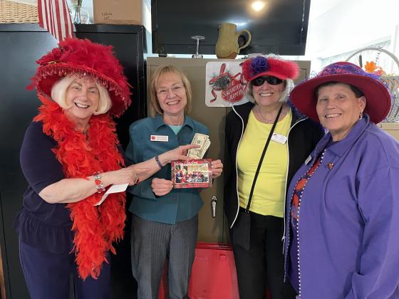 Red Hatters donate to Hope House. Submitted photo.