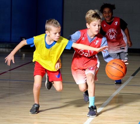 Youth hoops league opens season at YMCA.