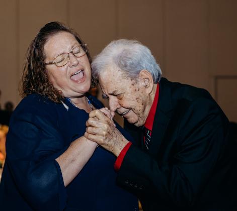 Larry Cochran, right, one of the honored seniors, and his caregiver, Nancy Chandler, dance to the music from Bold City Classics Band. Photo by Page Teahan Photography