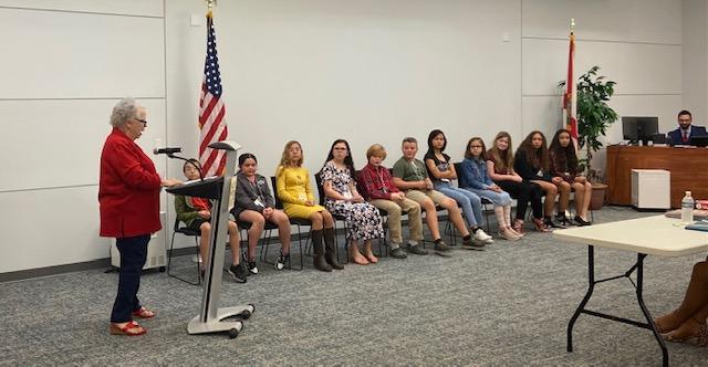 Spelling Bee contestants listen closely as the winner is announced.