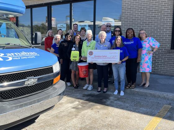 Barnabas employees and executives and board members, Firehouse Subs employees and executives, everyone involved in this good deed. Photo by Sean Rosenthal