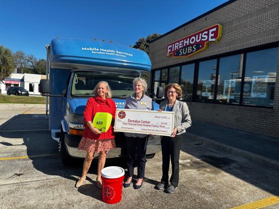 Pictured are, from left, Barnabas President and CEO Jamie Reynolds, Barnabas board member Liza Cotter and executive director at Firehouse Subs Public Safety Foundation, Robin Peters. Photo by Sean Rosenthal