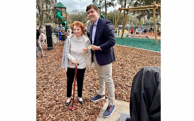 Mayor Bean presents the Key to the City to Betty Berkman at a ceremony to dedicate Teddy Bear Park. “I have not done this as mayor yet so I’m honored to give my first key to the city to Mrs. Betty,” the mayor said. “Mrs. Betty Berkman, our community, Fernandina Beach, is a better place because you are with us today.” Submitted photo